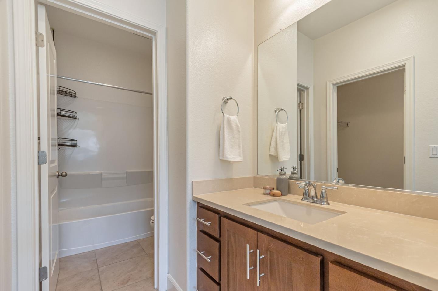 38984 Primula Terrace Newark, CA 94560 - Photo 24 of 32 a bathroom with a granite countertop sink mirror and double