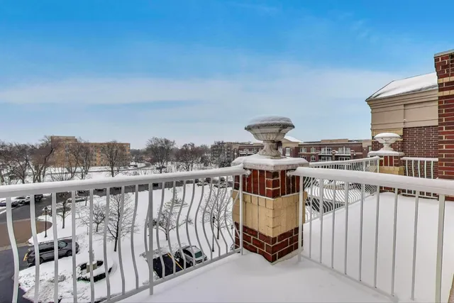 a view of a balcony with chairs