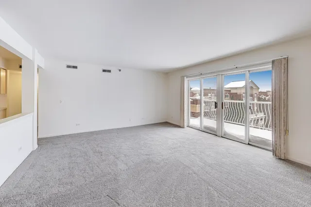 a view of an empty room with a sliding door