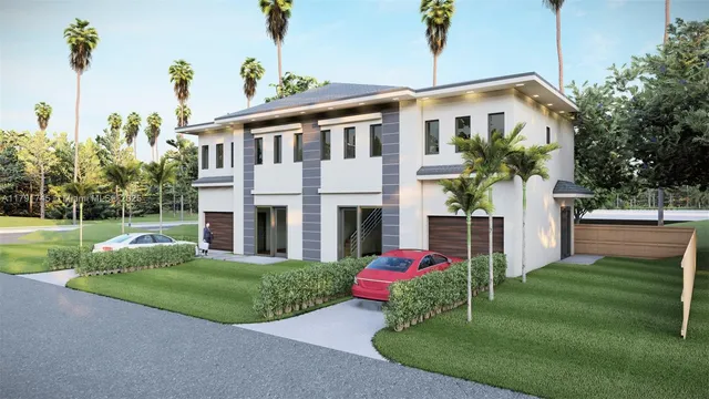 a front view of a house with yard and green space