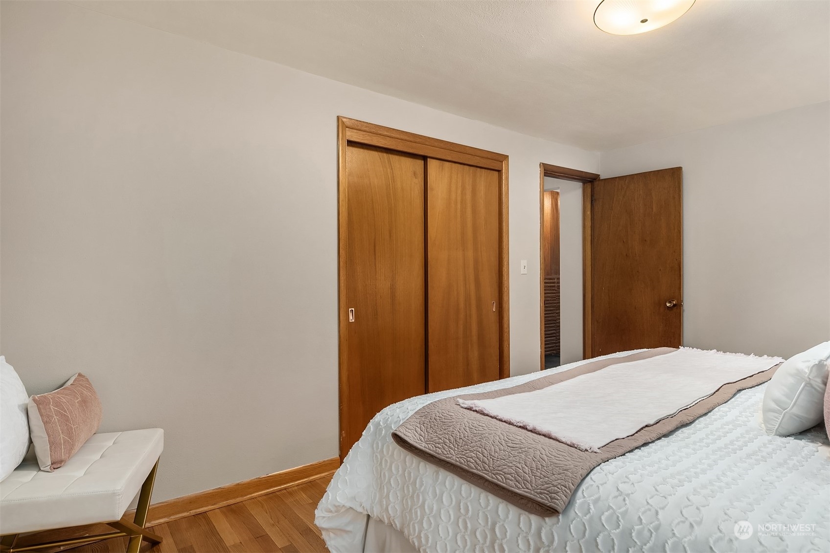 17512 Fremont Avenue North Shoreline, WA 98133 - Photo 15 of 35 a bedroom with a bed and chair