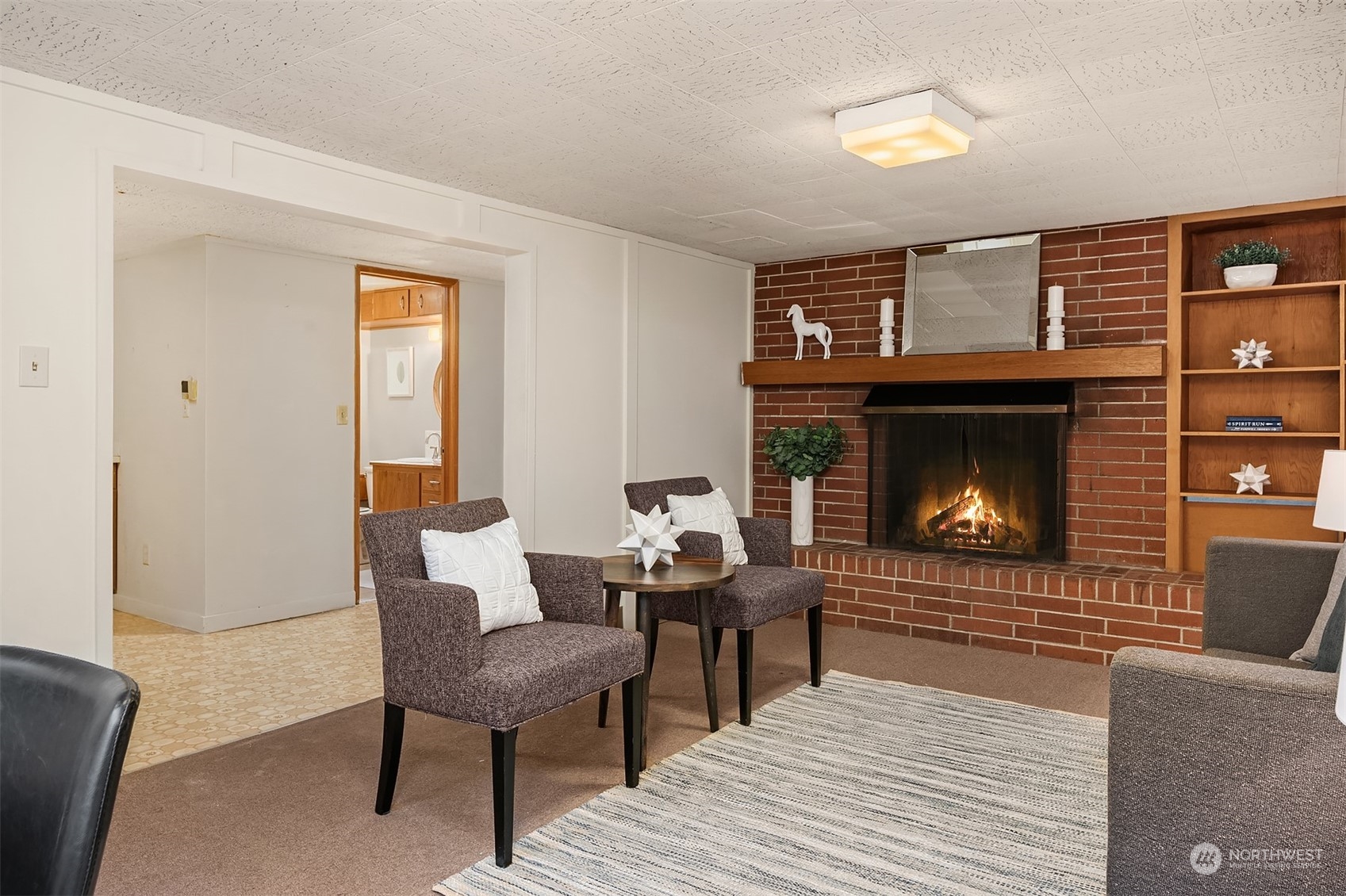 17512 Fremont Avenue North Shoreline, WA 98133 - Photo 18 of 35 a living room with furniture and a fireplace
