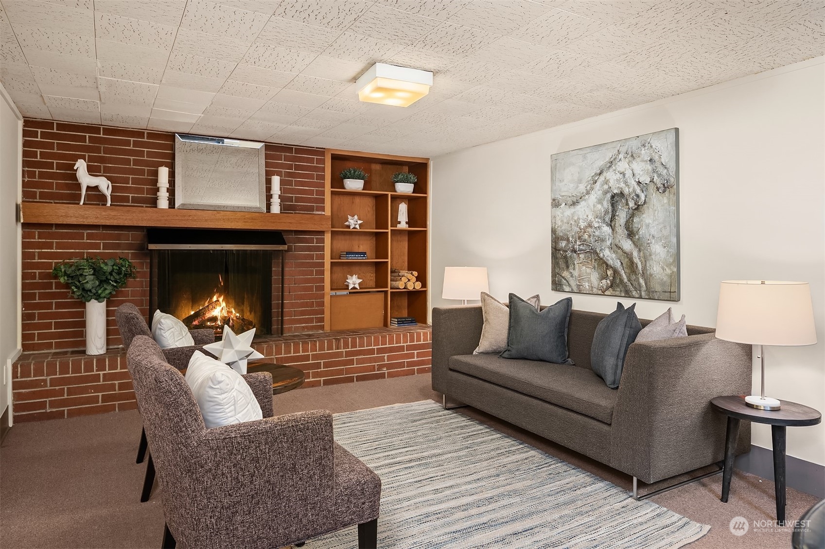17512 Fremont Avenue North Shoreline, WA 98133 - Photo 19 of 35 a living room with furniture and a fireplace