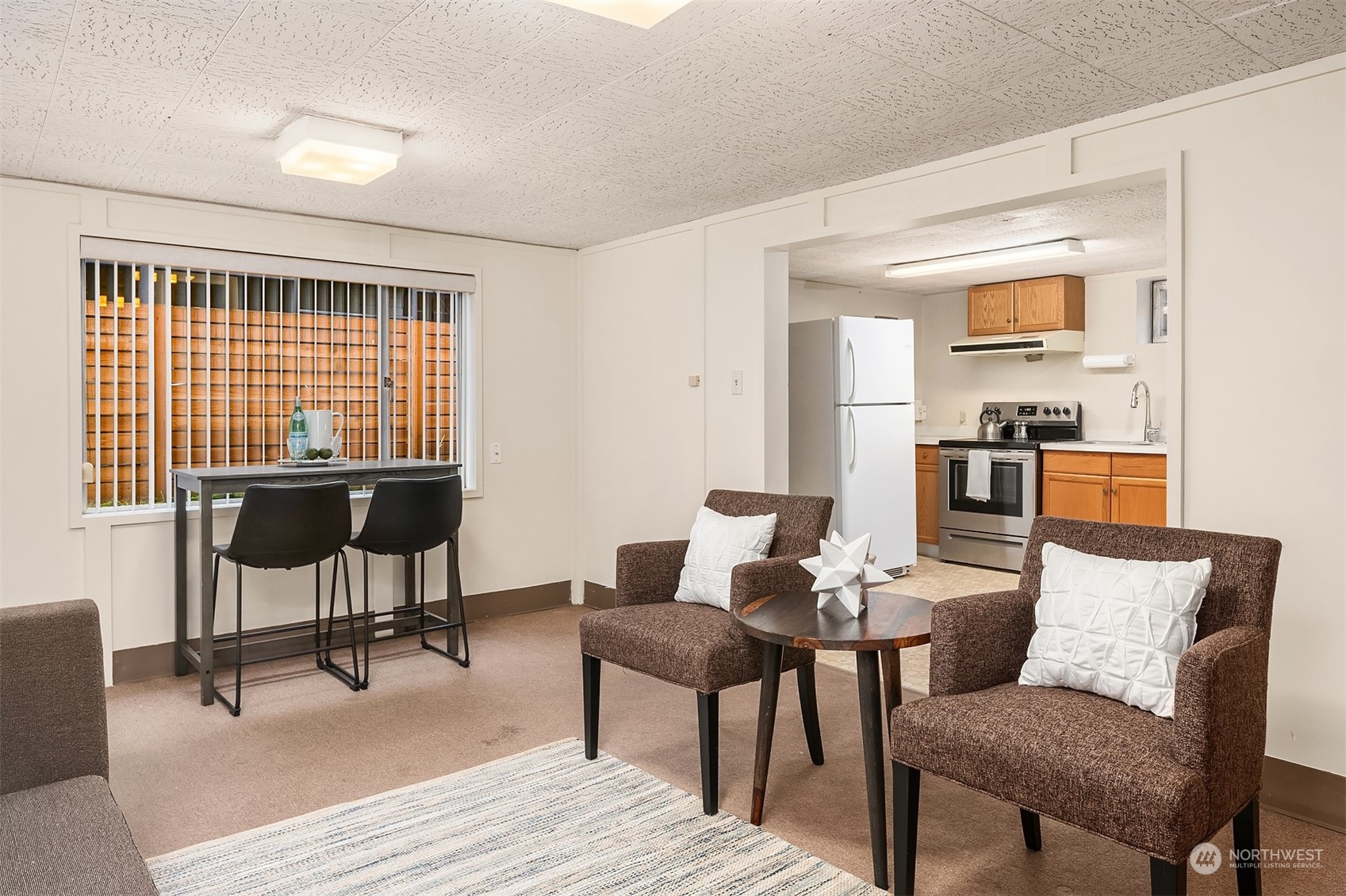 17512 Fremont Avenue North Shoreline, WA 98133 - Photo 20 of 35 a view of a livingroom with furniture and a window