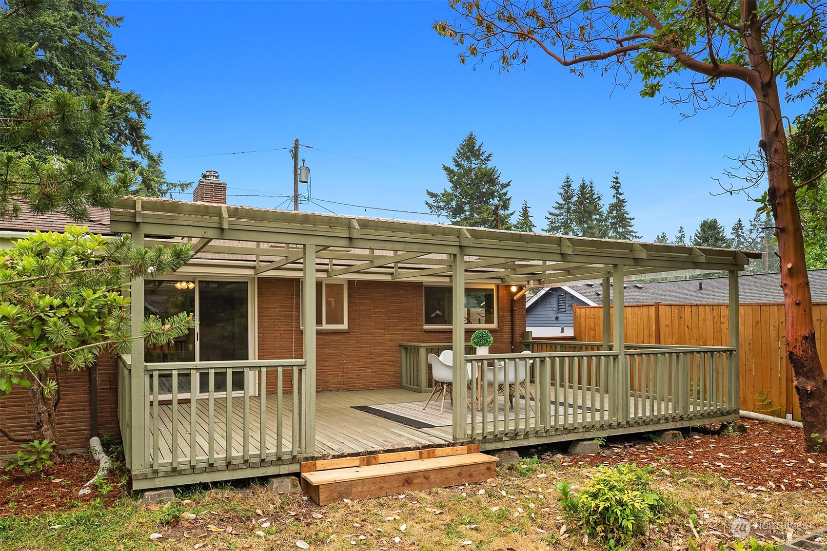 17512 Fremont Avenue North Shoreline, WA 98133 - Photo 30 of 35 a view of a brick house with a large window