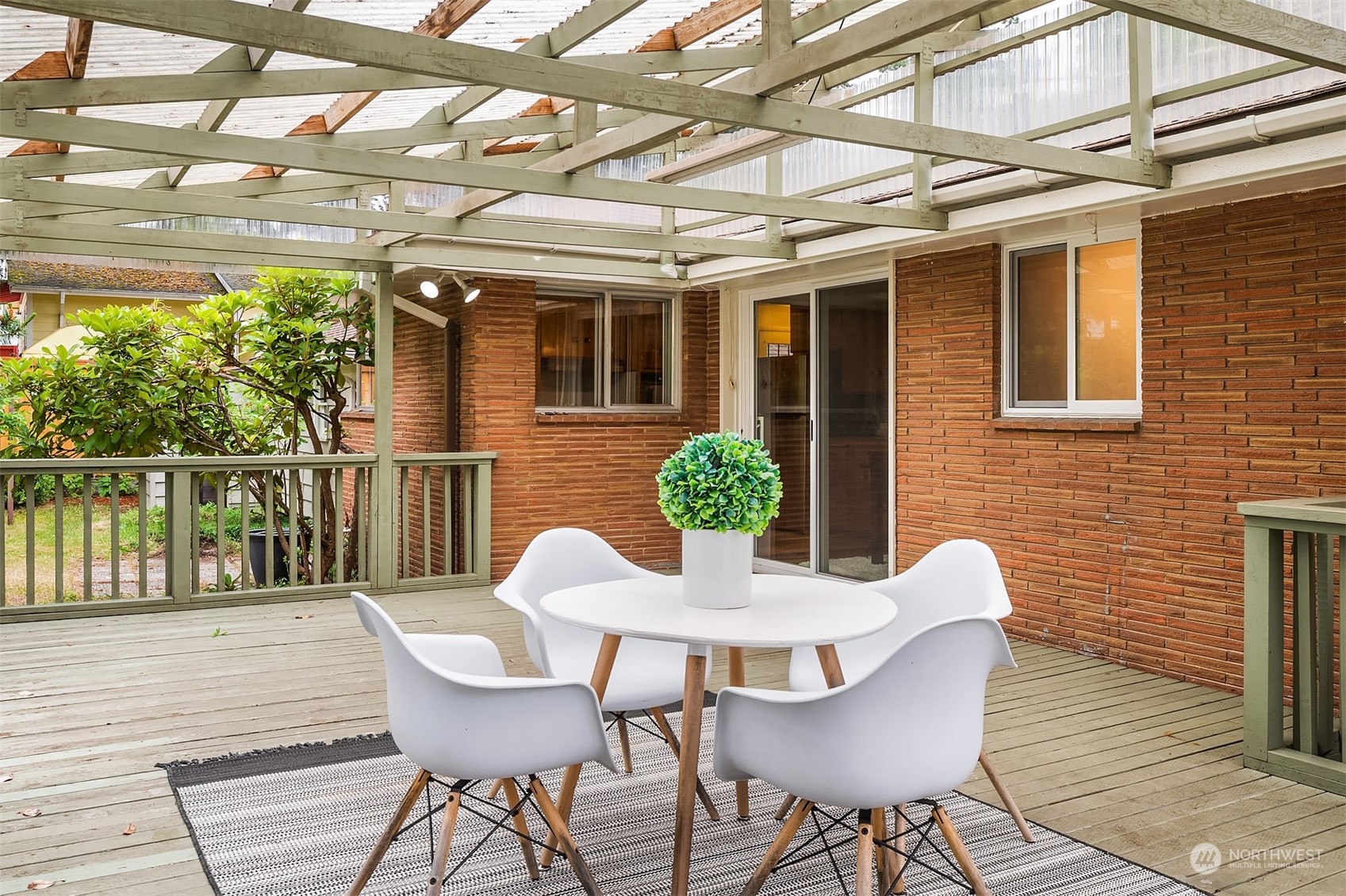 17512 Fremont Avenue North Shoreline, WA 98133 - Photo 31 of 35 a view of a chair and table in the patio