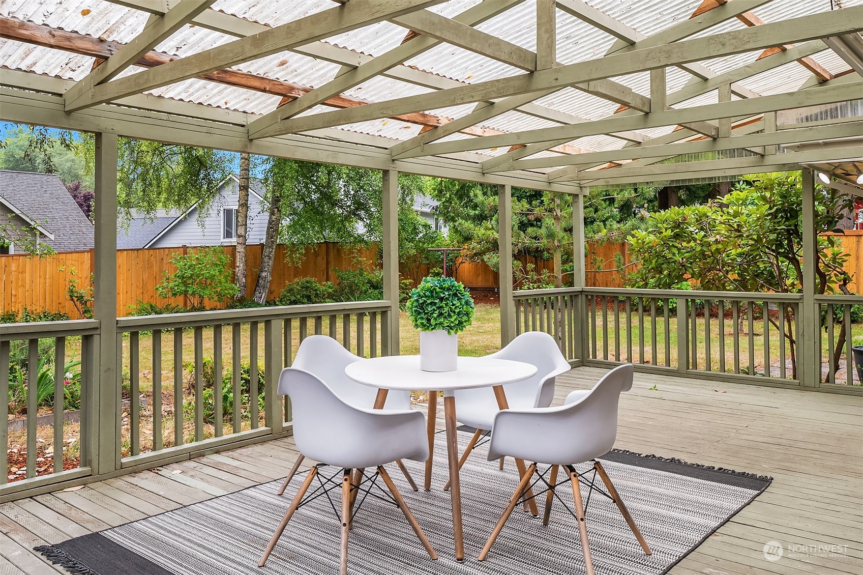 17512 Fremont Avenue North Shoreline, WA 98133 - Photo 32 of 35 a view of a dining room with furniture window and outside view