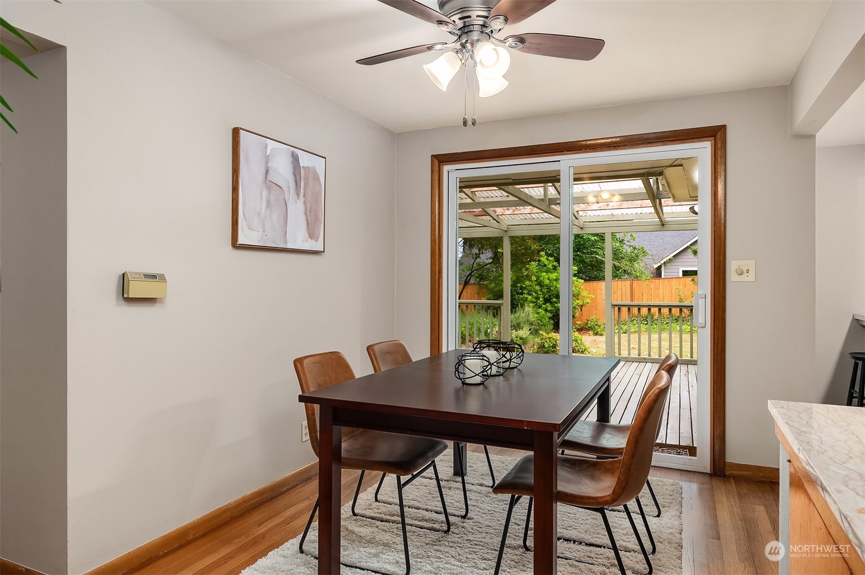 17512 Fremont Avenue North Shoreline, WA 98133 - Photo 6 of 35 a view of a dining room with furniture window and wooden floor