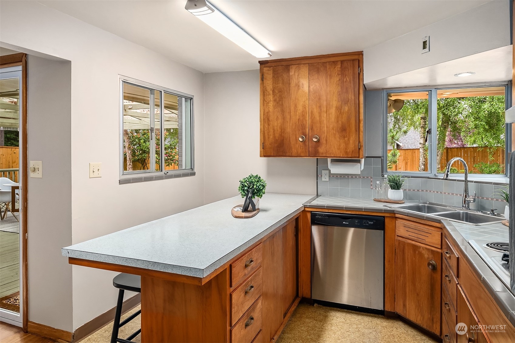 17512 Fremont Avenue North Shoreline, WA 98133 - Photo 9 of 35 a kitchen with a sink stove and microwave