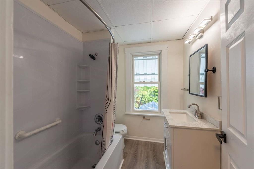 619 Barclay Avenue Pittsburgh, PA 15221 - Photo 15 of 23 a bathroom with a sink a toilet and shower