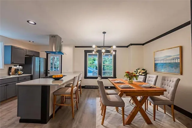 a view of a dining room with furniture window and outside view
