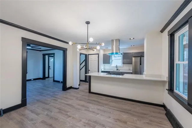 a view of a kitchen with windows