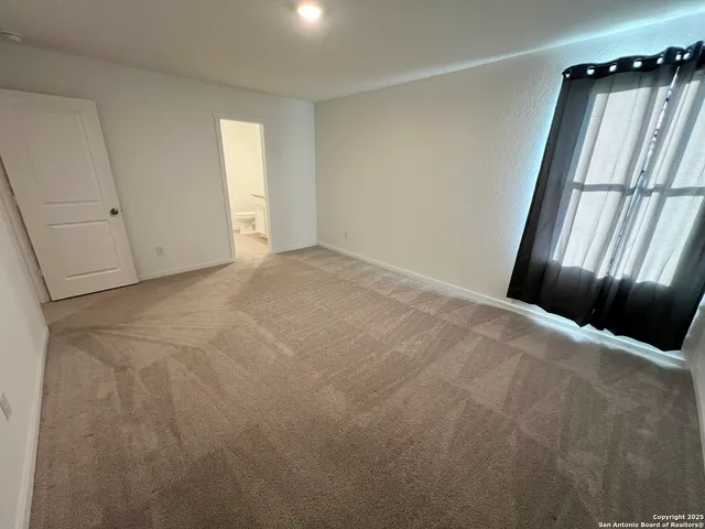 a bathroom with a sink toilet and mirror