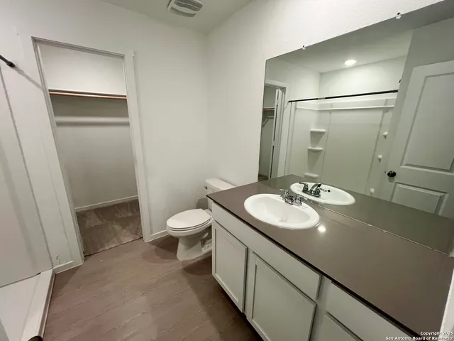 a bathroom with a shower and toilet