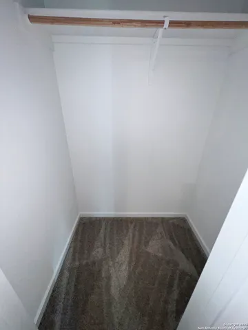 a view of a room with a wooden floor