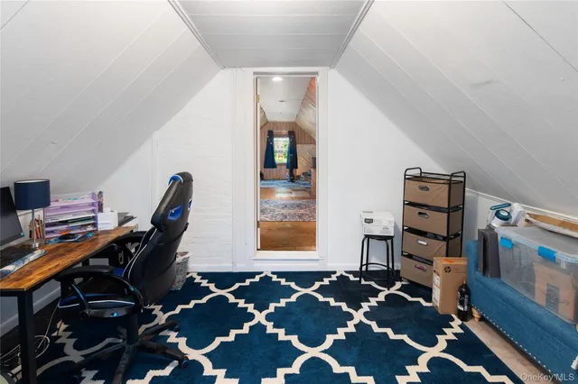 a room with furniture and wooden floor