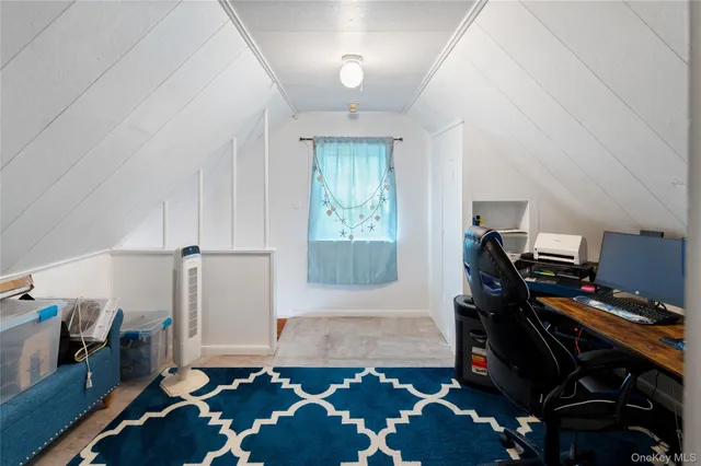 a view of a patio with table and chairs potted plants and large tree
