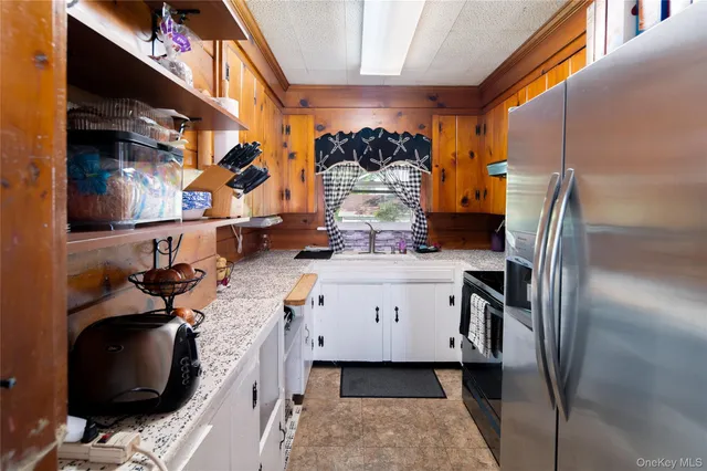 a bedroom with two beds and a window