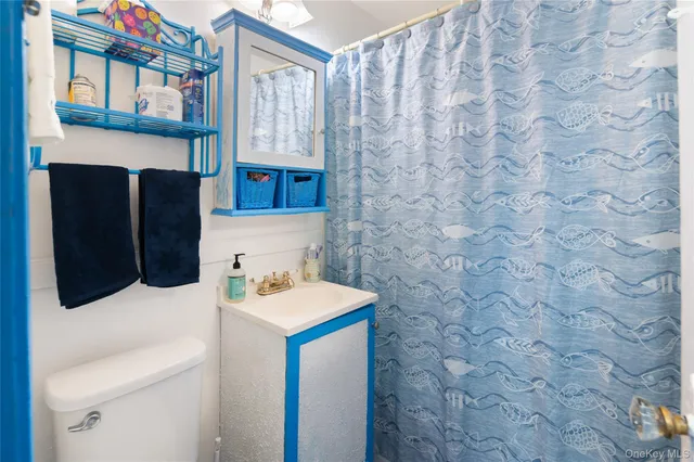 a living room with furniture fireplace and a large window
