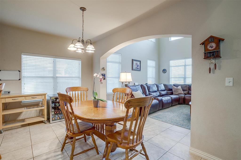 2536 Glenn Ranch Drive Burleson, TX 76028 - Photo 13 of 40 a view of a dining room with furniture and a chandelier