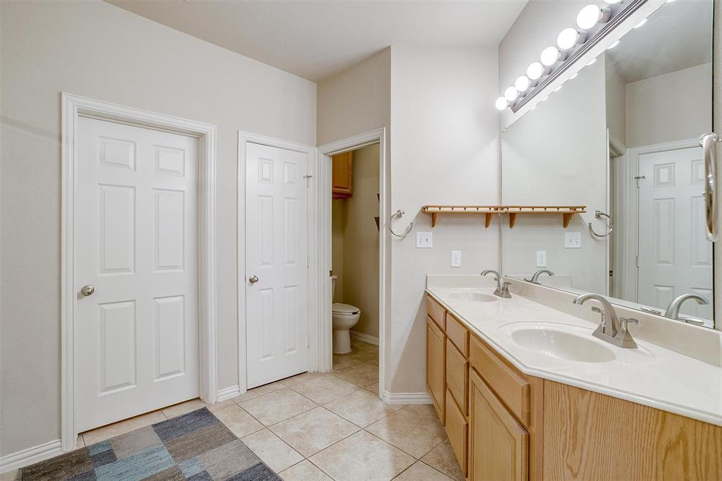2536 Glenn Ranch Drive Burleson, TX 76028 - Photo 19 of 40 a bathroom with a sink double vanity and a mirror