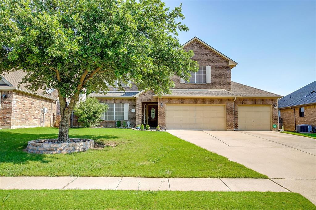 2536 Glenn Ranch Drive Burleson, TX 76028 - Photo 2 of 40 a front view of a house with a yard and garage