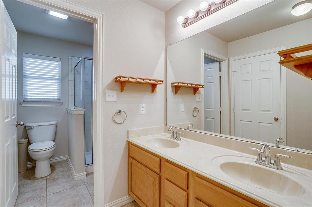 2536 Glenn Ranch Drive Burleson, TX 76028 - Photo 35 of 40 a bathroom with a sink and a mirror