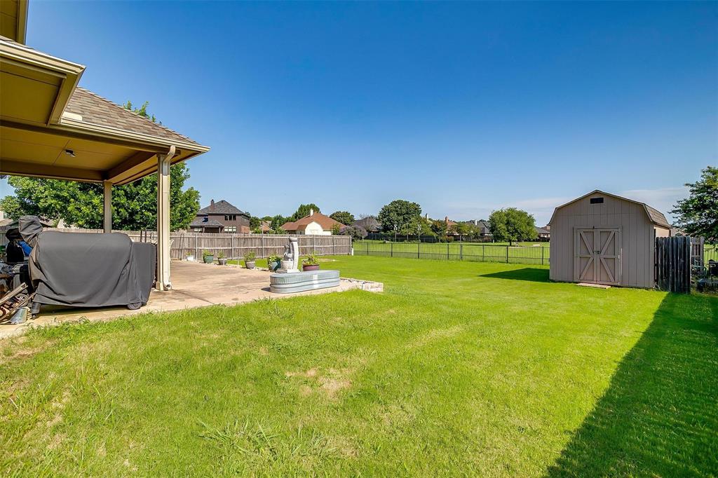 2536 Glenn Ranch Drive Burleson, TX 76028 - Photo 38 of 40 a view of a patio with table and chairs a barbeque