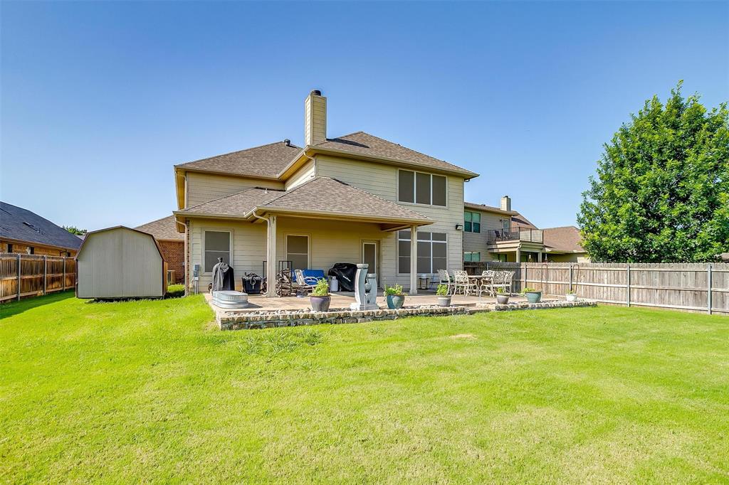 2536 Glenn Ranch Drive Burleson, TX 76028 - Photo 39 of 40 a front view of a house with swimming pool having outdoor seating
