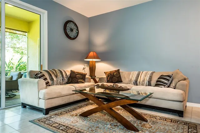 a living room with furniture and a rug
