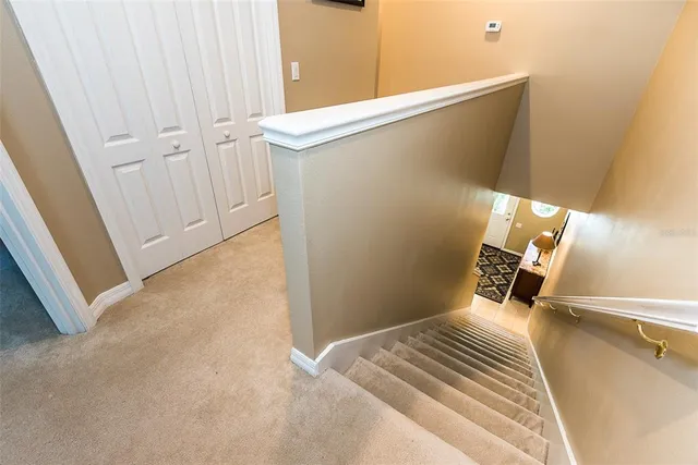 a bedroom with a bed and a mirror