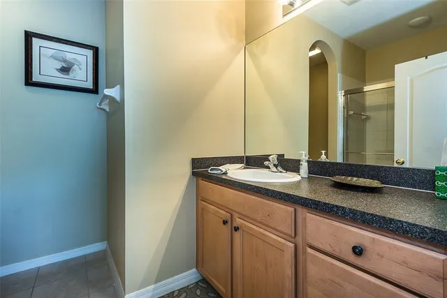 a bathroom with a double vanity sink and a mirror