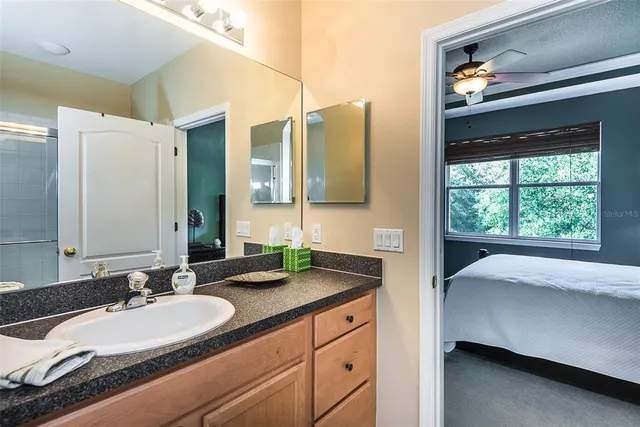 a bathroom with a double vanity sink and a mirror