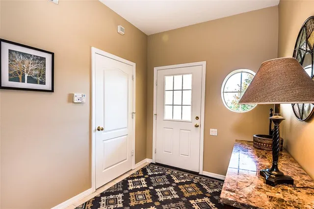 a view of an entryway with wooden floor