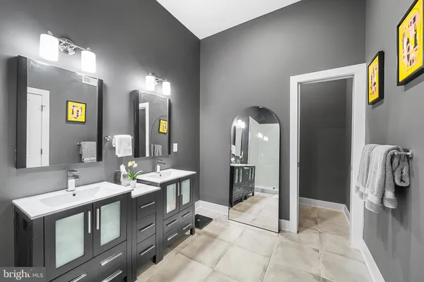 a white toilet sitting next to a white walls