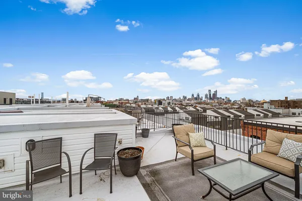 a view of a cars park in front of a building