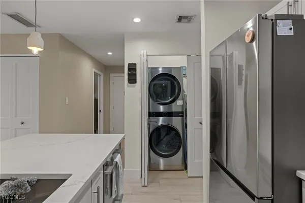a view of a kitchen with washer and dryer