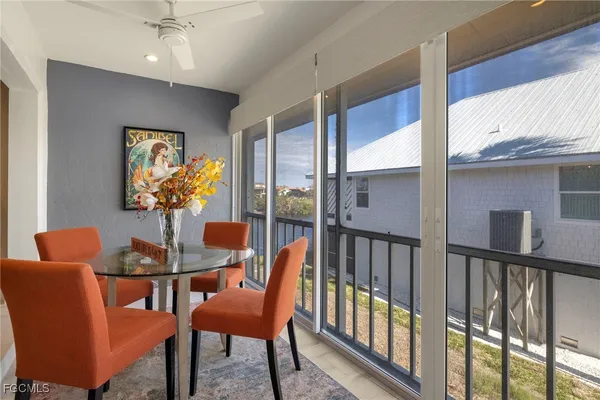 a dining room with furniture and window