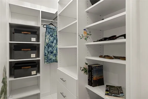 a kitchen with cabinets and appliances