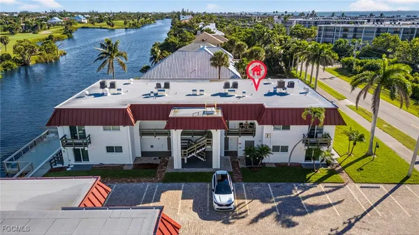 an aerial view of a house with swimming pool