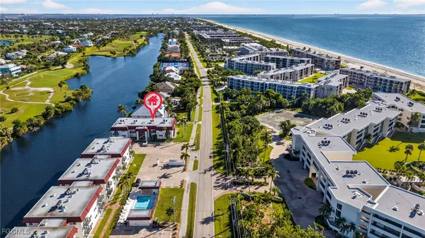 an aerial view of swimming pool patio and mountain view