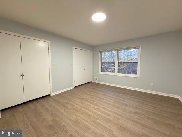 5915 Kingsford Road, Unit 365 Springfield, VA 22152 - Photo 16 of 28 wooden floor in an empty room with a window