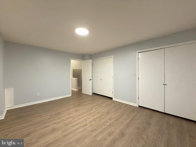 5915 Kingsford Road, Unit 365 Springfield, VA 22152 - Photo 17 of 28 a view of an empty room and wooden floor