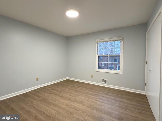 5915 Kingsford Road, Unit 365 Springfield, VA 22152 - Photo 18 of 28 wooden floor in an empty room with a window