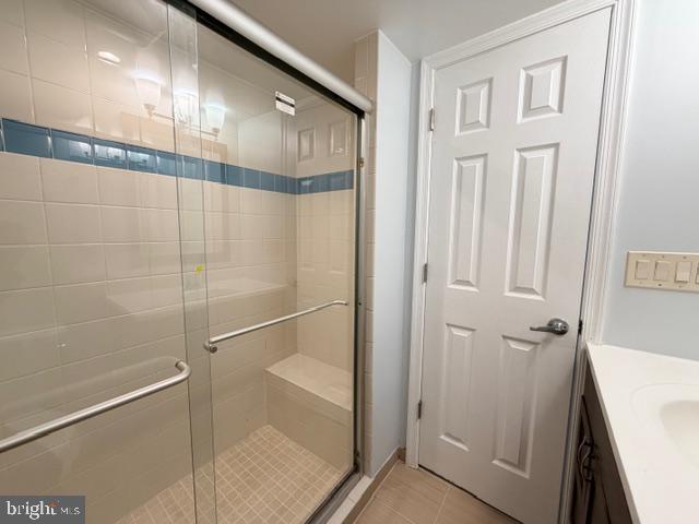 5915 Kingsford Road, Unit 365 Springfield, VA 22152 - Photo 24 of 28 a bathroom with a glass shower door