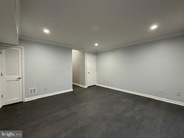 5915 Kingsford Road, Unit 365 Springfield, VA 22152 - Photo 26 of 28 an empty room with wooden floor and windows