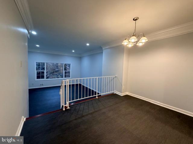 5915 Kingsford Road, Unit 365 Springfield, VA 22152 - Photo 4 of 28 an empty room with wooden floor chandelier and windows