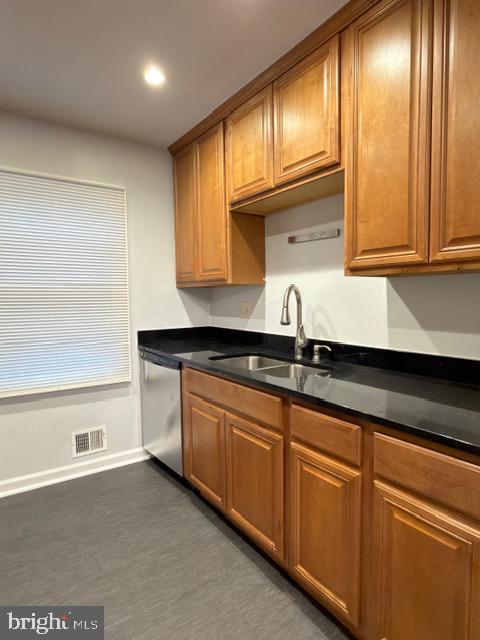 5915 Kingsford Road, Unit 365 Springfield, VA 22152 - Photo 9 of 28 a kitchen with granite countertop cabinets and sink