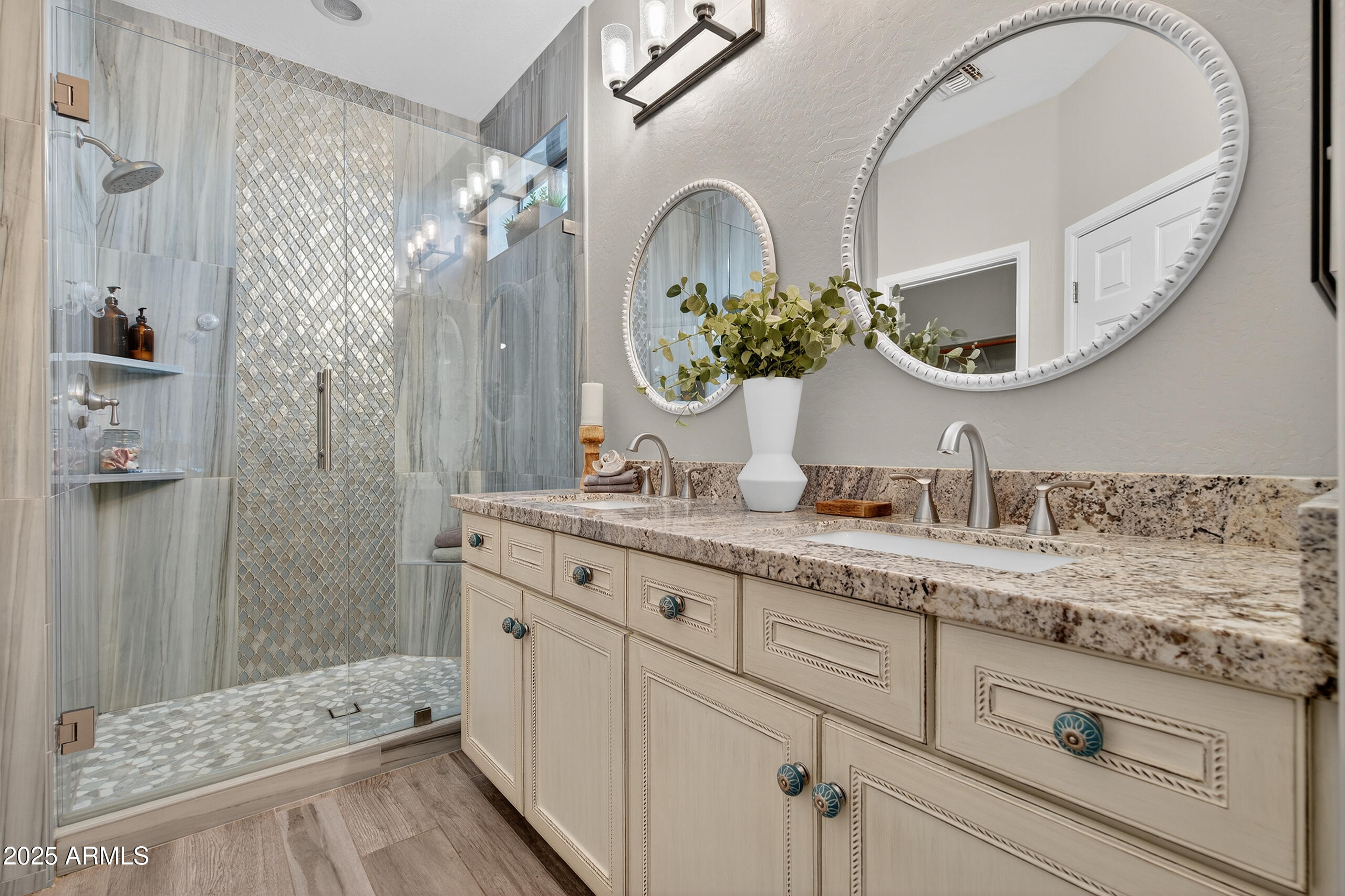 3021 East Agritopia Loop North Gilbert, AZ 85296 - Photo 21 of 68 a bathroom with a double vanity sink mirror and shower