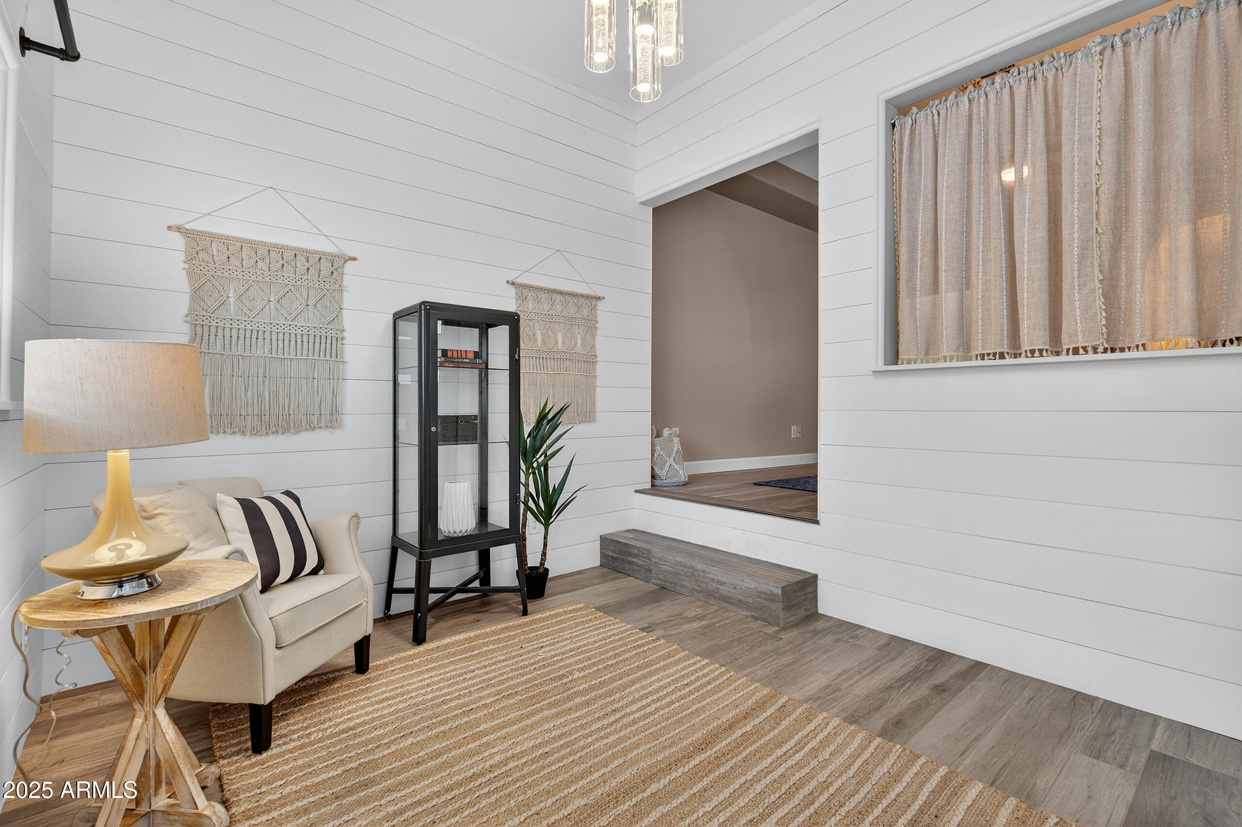 3021 East Agritopia Loop North Gilbert, AZ 85296 - Photo 23 of 68 a view of a livingroom with furniture and wooden floor
